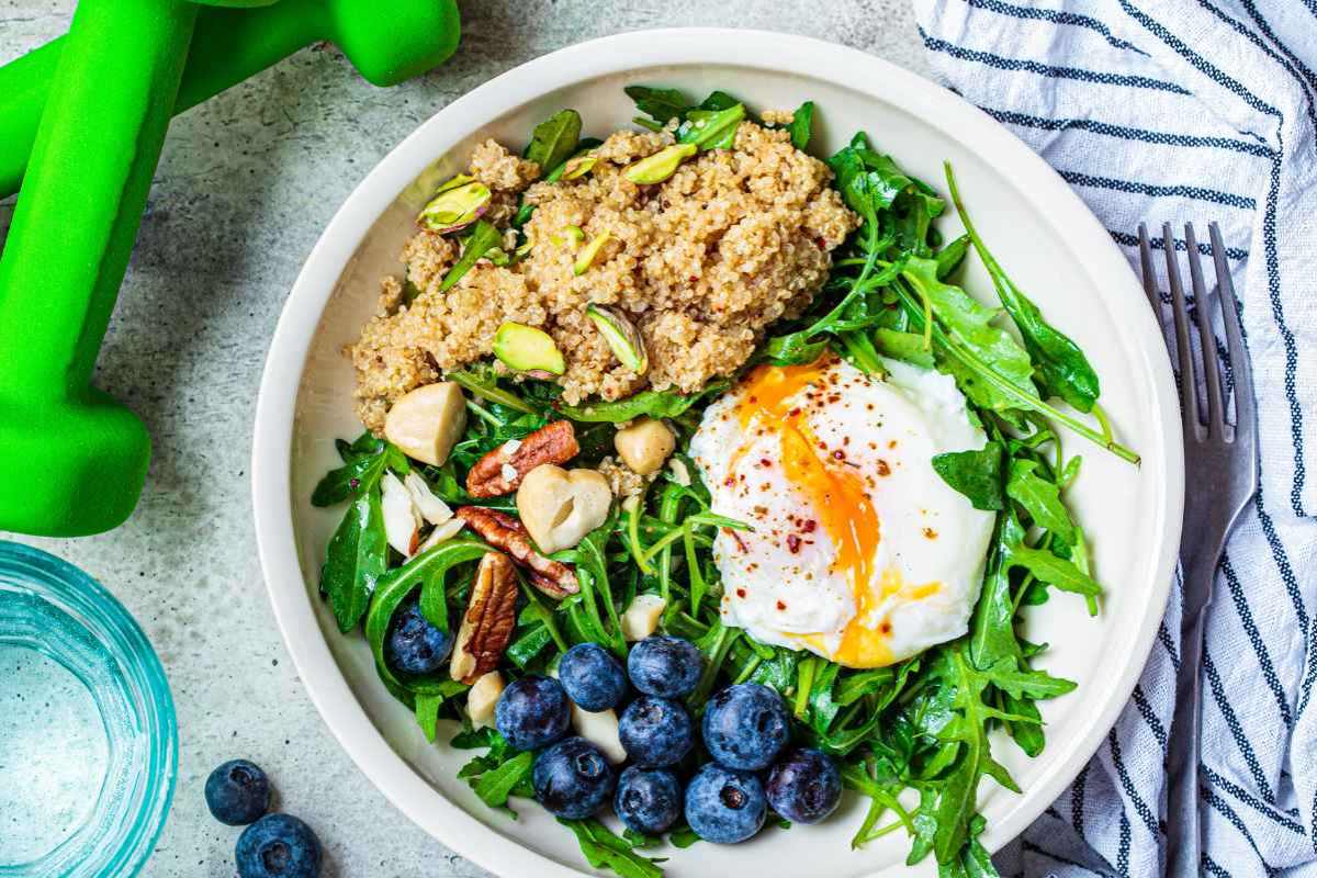 Quinoa Bowl with Spinach, Walnuts, and Poached Egg