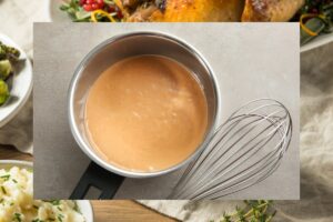 Homemade turkey gravy in a silver gravy boat on a Thanksgiving table