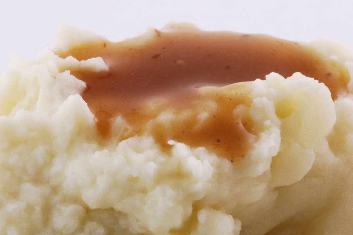 Mashed potatoes topped with turkey gravy
